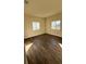 Bright bedroom with hardwood floors and two windows at 314 N 6Th St, Haines City, FL 33844