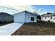 Newly built home featuring a contemporary design and a paved driveway at 314 N 6Th St, Haines City, FL 33844
