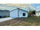 Newly constructed home with modern facade and concrete driveway at 314 N 6Th St, Haines City, FL 33844