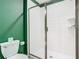 Clean bathroom with glass shower and white tile at 4563 Narrative Ln, Kissimmee, FL 34746