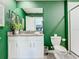Bathroom with a vanity, toilet, and shower at 4563 Narrative Ln, Kissimmee, FL 34746