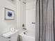 Updated bathroom with a shower/tub combo and stylish decor at 4563 Narrative Ln, Kissimmee, FL 34746