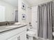 Clean bathroom with a tub, shower, and updated vanity at 4563 Narrative Ln, Kissimmee, FL 34746