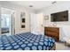 Bedroom with a queen bed and ensuite bathroom at 4563 Narrative Ln, Kissimmee, FL 34746