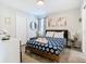 Bright bedroom with a queen bed and stylish decor at 4563 Narrative Ln, Kissimmee, FL 34746