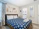 Bedroom with a queen bed and ensuite bathroom at 4563 Narrative Ln, Kissimmee, FL 34746