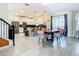 Bright dining area with a wooden table and pink chairs at 4563 Narrative Ln, Kissimmee, FL 34746