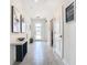 Bright and airy entryway with tile flooring and wall art at 4563 Narrative Ln, Kissimmee, FL 34746