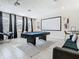 Game room with pool table, projector, and seating at 4563 Narrative Ln, Kissimmee, FL 34746