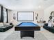 Game room with pool table and large projection screen at 4563 Narrative Ln, Kissimmee, FL 34746