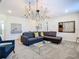 Spacious game room with sectional sofa and game accents at 4563 Narrative Ln, Kissimmee, FL 34746
