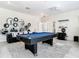 Game room with pool table and gear wall art at 4563 Narrative Ln, Kissimmee, FL 34746