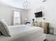 Elegant main bedroom with king-size bed and gold accents at 4563 Narrative Ln, Kissimmee, FL 34746