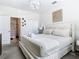 Spacious main bedroom with king-size bed and ensuite bathroom at 4563 Narrative Ln, Kissimmee, FL 34746