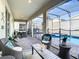 Outdoor patio with seating and a view of the pool at 4563 Narrative Ln, Kissimmee, FL 34746