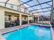 Private screened pool and spa with lounge chairs at 4563 Narrative Ln, Kissimmee, FL 34746