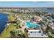 Large community pool with a clubhouse and lake views at 4563 Narrative Ln, Kissimmee, FL 34746