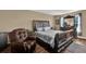 Bright bedroom with a comfortable recliner chair at 1823 Laredo Dr, Deltona, FL 32738