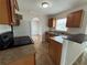 Kitchen boasts granite countertops, wood cabinets, and black appliances at 3013 Lagoon Ave, Deltona, FL 32738