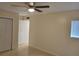 Bright bedroom with neutral walls, tile floors, and a ceiling fan at 327 Scottsdale Sq # 327, Winter Park, FL 32792