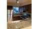 Modern kitchen with stainless steel appliances and granite countertops at 327 Scottsdale Sq # 327, Winter Park, FL 32792