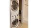 Stackable washer and dryer in a closet with water heater at 327 Scottsdale Sq # 327, Winter Park, FL 32792