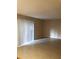 Spacious living room with tile flooring and sliding glass door at 327 Scottsdale Sq # 327, Winter Park, FL 32792