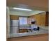 Galley kitchen with stainless steel appliances and granite countertops at 348 Scottsdale Sq # 348, Winter Park, FL 32792