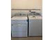 Laundry room with a Whirlpool washer and dryer at 348 Scottsdale Sq # 348, Winter Park, FL 32792