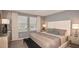 Spacious bedroom with large windows and neutral decor at 3557 Mayfair St, Kissimmee, FL 34758