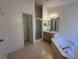 Bathroom with soaking tub, shower, and double vanity at 5453 Shingle Creek Dr, Orlando, FL 32821