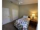 Well-lit bedroom, including a twin bed and double doors leading to closet at 5453 Shingle Creek Dr, Orlando, FL 32821