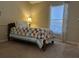 Charming bedroom with a twin bed and colorful quilt at 5453 Shingle Creek Dr, Orlando, FL 32821