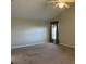 Spacious bedroom with carpeted floor and large window at 5453 Shingle Creek Dr, Orlando, FL 32821