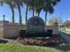 Water view community entrance with festive holiday decor at 5453 Shingle Creek Dr, Orlando, FL 32821