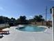 Relaxing kidney-shaped community pool with lounge chairs at 5453 Shingle Creek Dr, Orlando, FL 32821