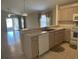 Kitchen features light-toned cabinetry, white appliances, and a breakfast bar at 5453 Shingle Creek Dr, Orlando, FL 32821