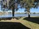 Scenic view of a lake with houses and lush greenery at 5453 Shingle Creek Dr, Orlando, FL 32821
