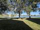 Beautiful lakefront view from a property, showcasing a tranquil neighborhood setting at 5453 Shingle Creek Dr, Orlando, FL 32821