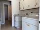 Laundry area with washer, dryer, and cabinets at 5453 Shingle Creek Dr, Orlando, FL 32821