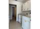 Functional laundry room, including washer, dryer, and additional storage at 5453 Shingle Creek Dr, Orlando, FL 32821