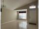 Living room with tile floors, window, and entryway at 5453 Shingle Creek Dr, Orlando, FL 32821