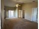 Spacious main bedroom with carpeting, access to the patio and ensuite bathroom at 5453 Shingle Creek Dr, Orlando, FL 32821