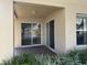 Covered patio with sliding doors and access to backyard at 5453 Shingle Creek Dr, Orlando, FL 32821