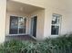 Private patio with sliding glass doors and view of water at 5453 Shingle Creek Dr, Orlando, FL 32821