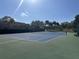 Well-maintained tennis court with surrounding landscape at 5453 Shingle Creek Dr, Orlando, FL 32821