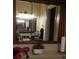 Bathroom with a mirrored medicine cabinet and shelving at 5850 Cypress Gardens Blvd # 304, Winter Haven, FL 33884