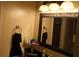 Bathroom with vanity, mirror, and granite countertop at 5850 Cypress Gardens Blvd # 304, Winter Haven, FL 33884