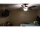 Bedroom with ceiling fan, wall-mounted TV, and bed at 5850 Cypress Gardens Blvd # 304, Winter Haven, FL 33884