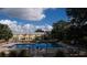 Refreshing community pool with surrounding landscaping at 5850 Cypress Gardens Blvd # 304, Winter Haven, FL 33884